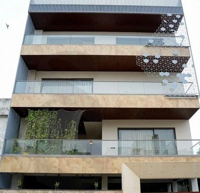 Agra Apartment, Agra: travertine and marble pillar boards on both facades