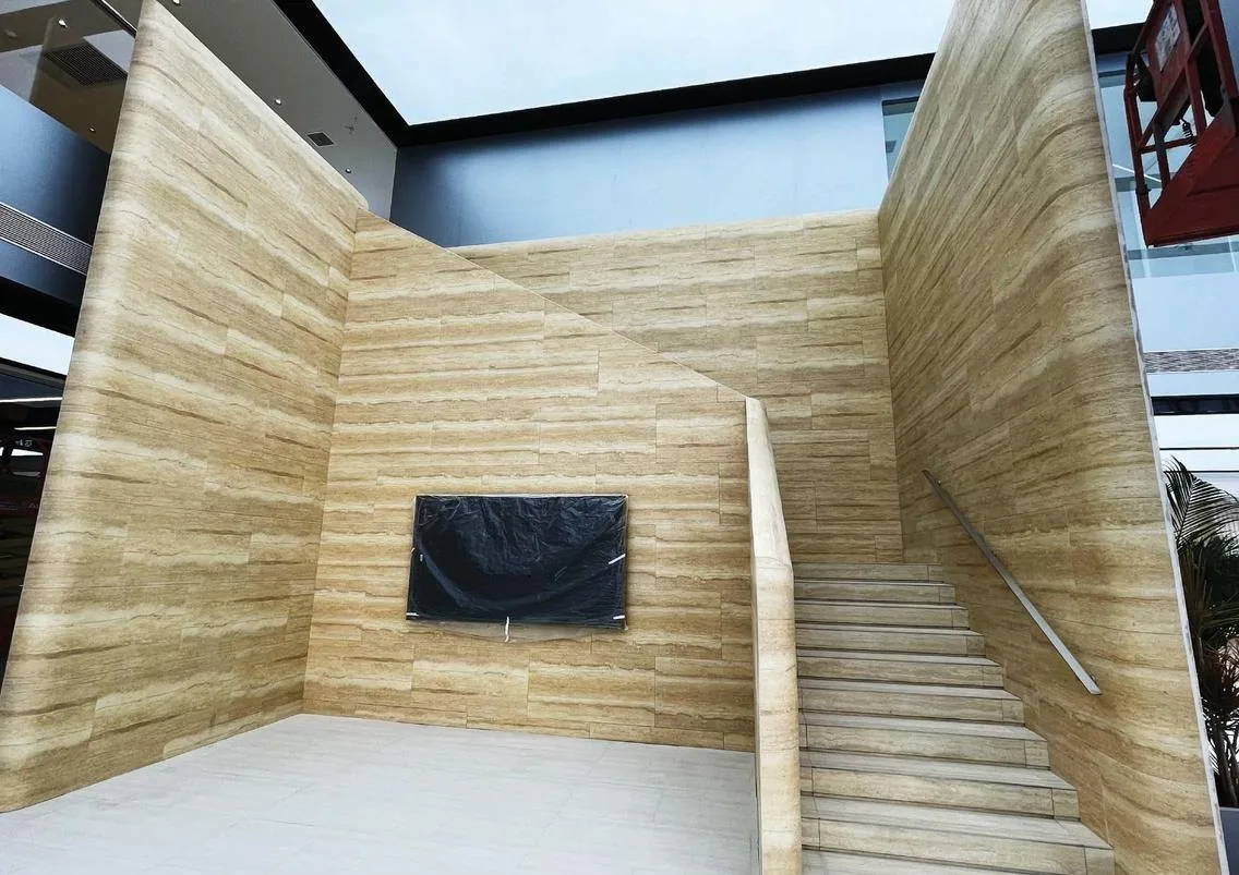 Linear Travertine on the walls of a stairwell, one plane running up two floors